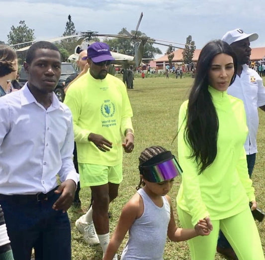 North West Wearing the Paparazzi Visor™ with her parents Kim Kardashian and Kanye West