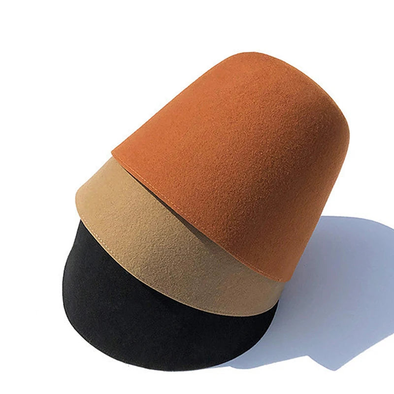 Three-tiered cylindrical cushion in orange, beige, and black on a white background with 'Ricygvm' branding.