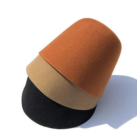 Three-tiered cylindrical cushion in orange, beige, and black on a white background with 'Ricygvm' branding.