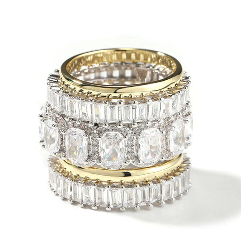 Gold and silver ring with clear gemstones on a white background, branded 'Uwin'.