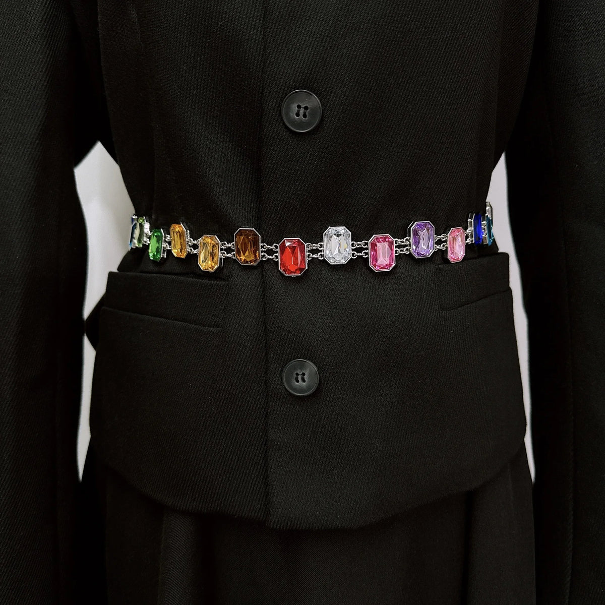 Black coat with a colorful gemstone belt