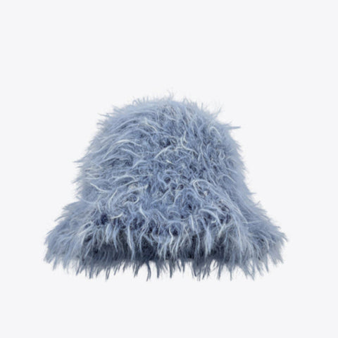 Blue fuzzy beanie on a white background