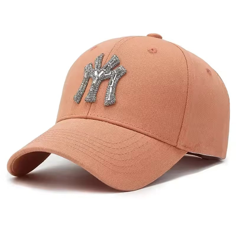 Pink baseball cap with a logo on a white background